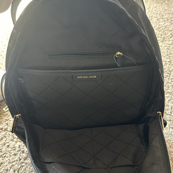 Used Michael Kors black canvas backpack. Black with black leopard spots. - Picture 5 of 5